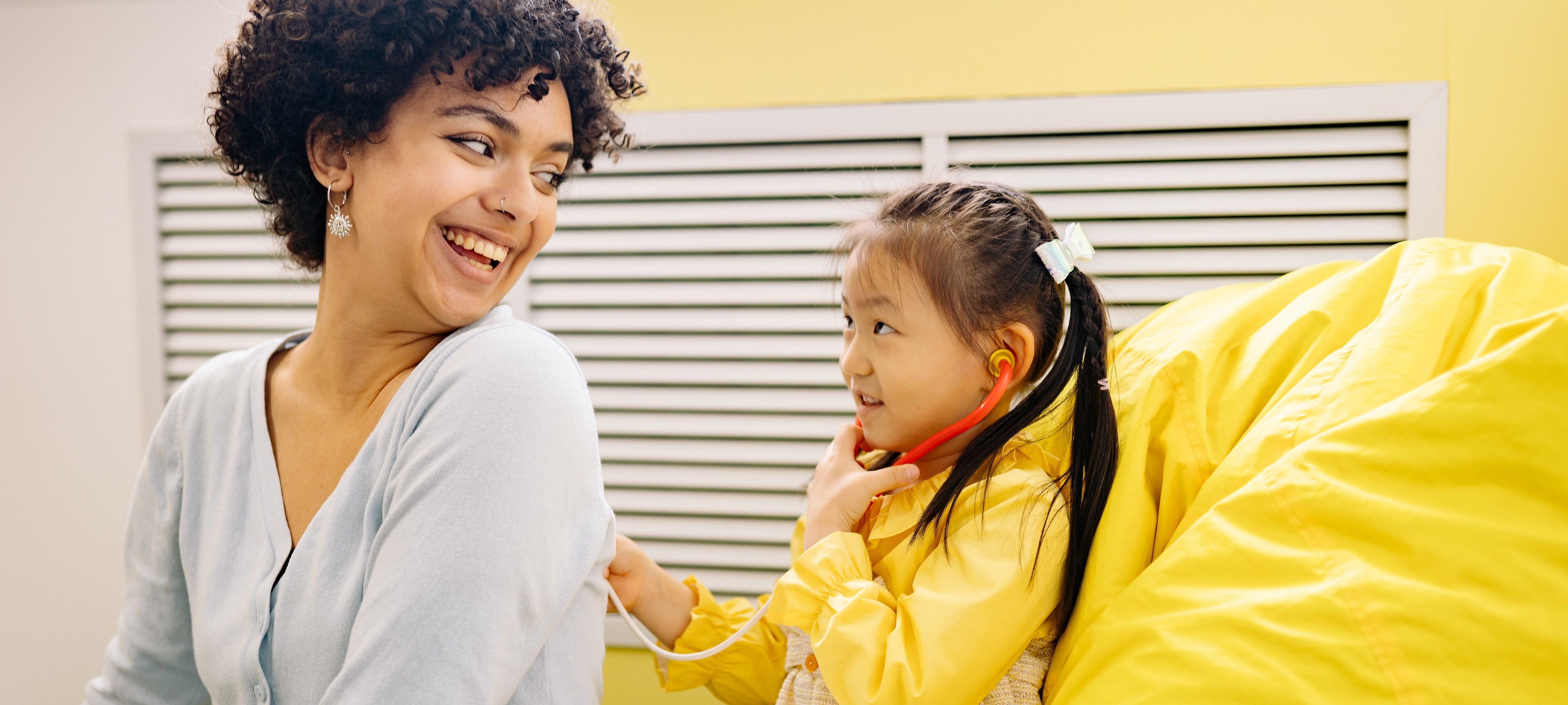 mother and daughter health check, playing doctor